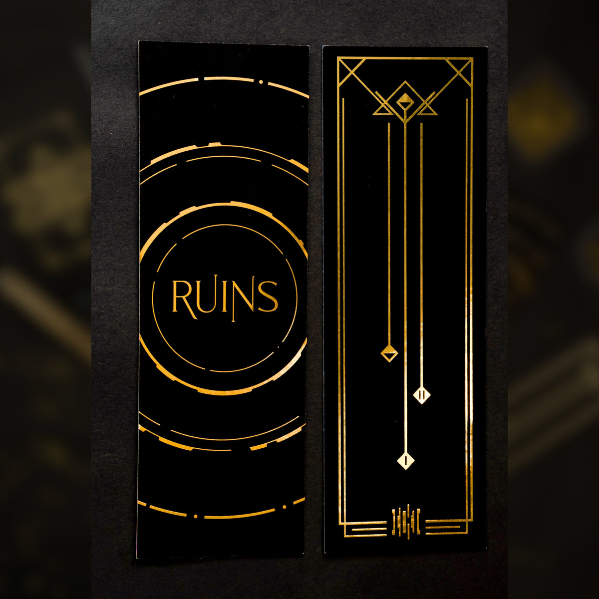 Gold foiled bookmark in Ruins' theme